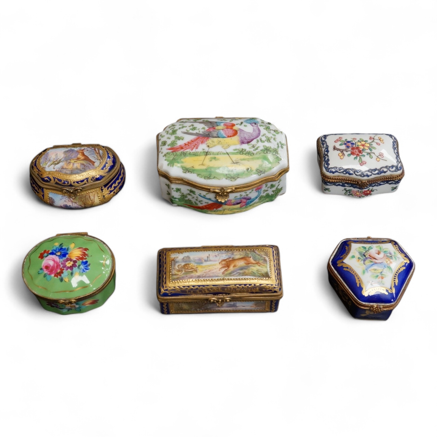 A collection of Continental hand painted and enamelled patch boxes, largest 9cm wide